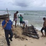 Cubans put to work dismantling boat Cubans put to work dismantling boat